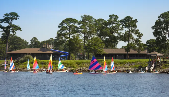 Several sailboats and kayaks near the waterfront