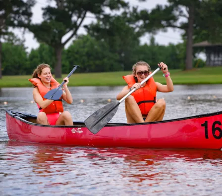 two girls in a canoe