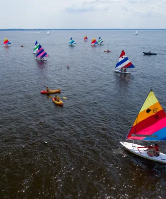 Sailboats headed out to sea