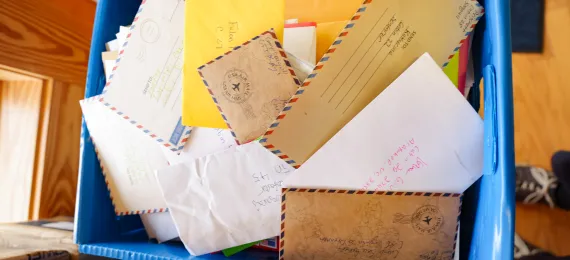 Box filled with letters to campers