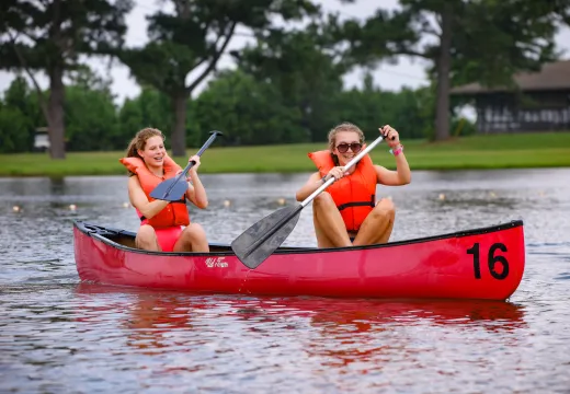 two girls in a canoe